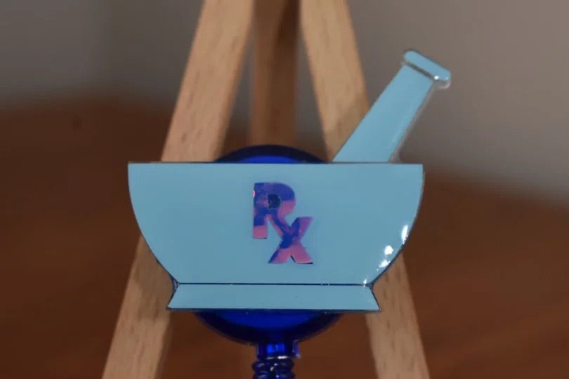 Mortar and pestle badge